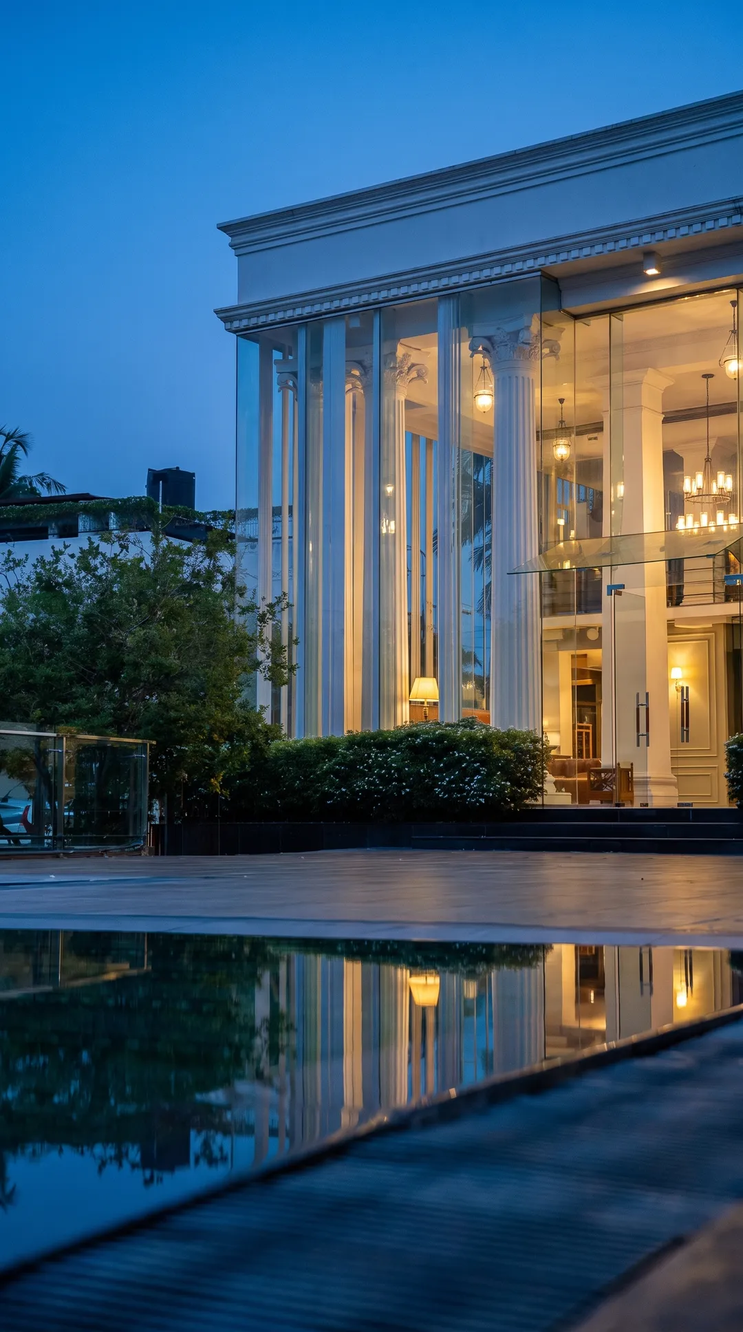 OSMO's colonial colonnade at blue hour, reflected in the water